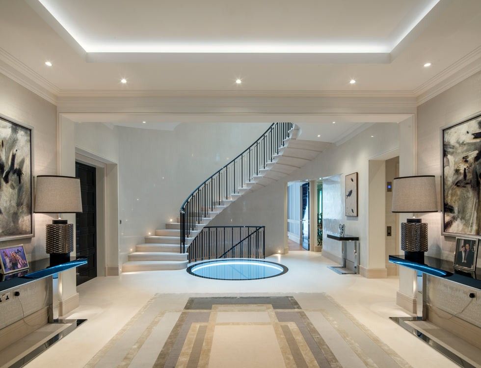 Family room with stairs to the basement and upper level