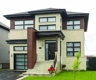  This home perfectly suited for a narrow lot. This contemporary house facade has mixed materials, panoramic windows and faced with fiber cement siding, stone. A hip roof, a low-pitched hip roof…