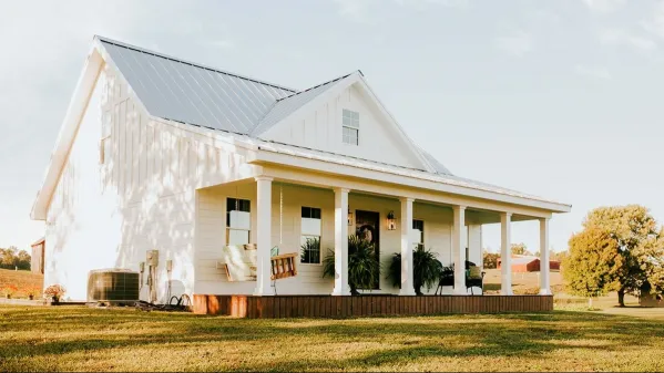 The plan of a frame house with an attic and a veranda in country style with…