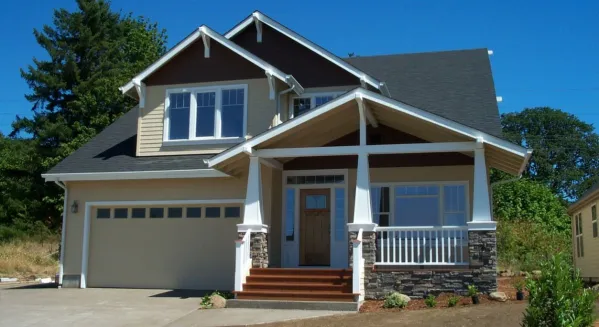  This country house plan has front porch arches, decorative wooden brackets, carved brackets and faced with horizontal siding. The a gable roof with large front facing gables completes the look of…