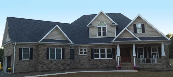 House facade has stucco and horizontal siding. A steep hipped roof, with several gable peaks completes the look of this house. House plan is 84 feet wide by 71 feet deep, and provides 2928 square feet…