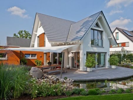 Plan of a house with an attic and attached garage for a small plot in the classic style