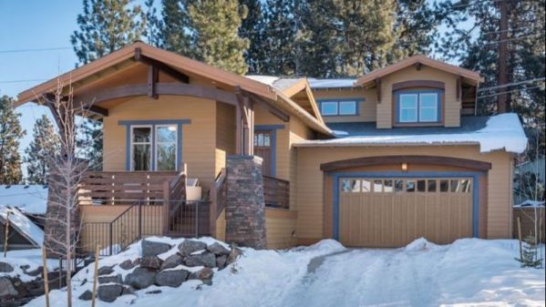 The architect has thought this plan through to the last detail—a beautiful facade with timber rafters, a garage, an open floor plan, and two bedrooms. The garage is half a story below the main…