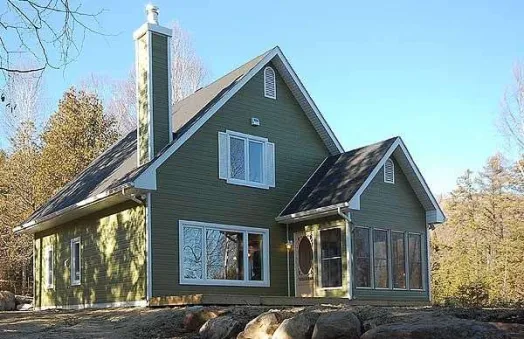  This home perfectly suited for a narrow lot. This vacation house facade has mixed materials, decorative trim, carved brackets, gable windows, casement windows and faced with horizontal siding.…